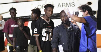 Migrants get medical checked after disembarking from the ‘Open Arms’ rescue ship.