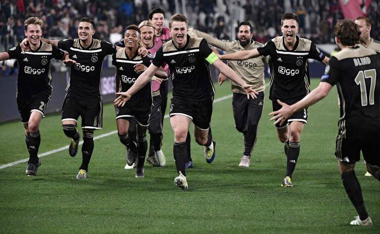 Ajax players celebrate moving onto the semifinals.