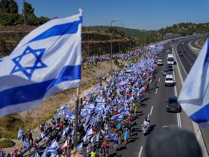 Thousands of Israelis march along a highway towards Jerusalem in protest of plans by Prime Minister Benjamin Netanyahu's government to overhaul the judicial system, near Abu Gosh, Israel, Saturday, July 22, 2023.