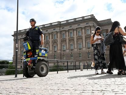 A police officer on a Segway patrols Sweden's parliament Riksdagen as the terror threat level in Sweden is raised to four on a five-point scale, in Stockholm, Sweden, August 17, 2023.