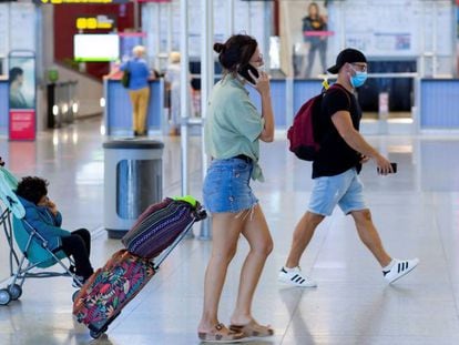 Travelers at Málaga airport in Spain.