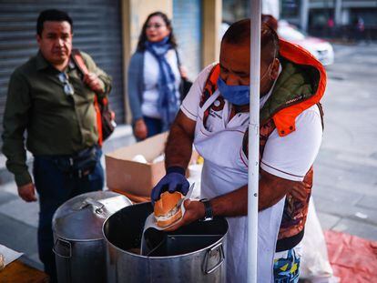 A vendor making torta de tamal in Mexico City. 