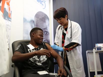 A young South African man receives an HIV vaccination as part of a scientific study in 2016.