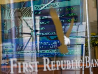 A television screen displaying financial news is seen inside one of First Republic Bank's branches in the Financial District of Manhattan, on March 16, 2023.