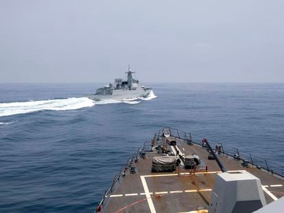 In this photo provided by the U.S. Navy, the USS Chung-Hoon observes a Chinese navy ship conduct what it called an "unsafe” Chinese maneuver in the Taiwan Strait, on June 3, 2023.