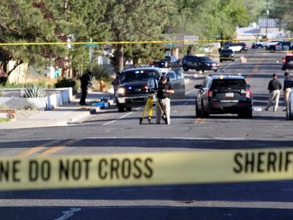 Investigators work along a residential street following a deadly shooting on May 15, 2023, in Farmington, New Mexico.