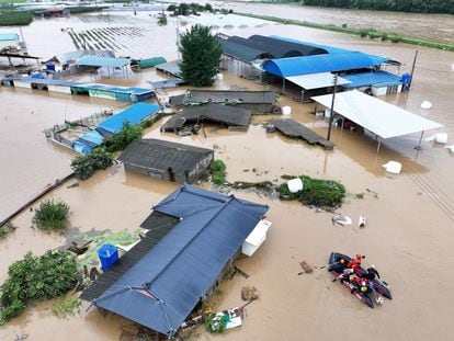 Rescue workers take part in a rescue operation at a town submerged by typhoon Khanun in Daegu, South Korea, on August 10, 2023.