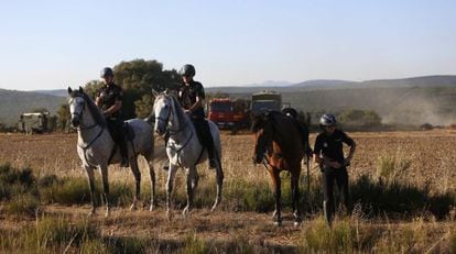 Police on horseback search for the missing US tourist near Castrillo de los Polvazares.