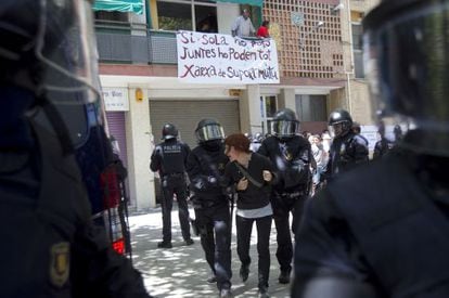 Catalan police dislodge a protestor at an eviction last year in Clot, Barcelona.