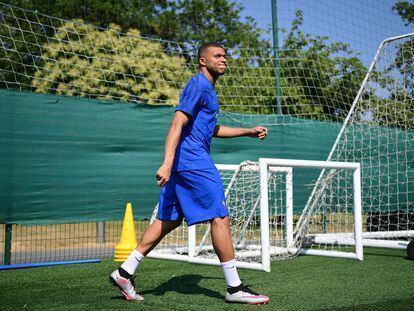 France's forward Kylian Mbappe arrives for a training session in Clairefontaine-en-Yvelines on June 14, 2023.