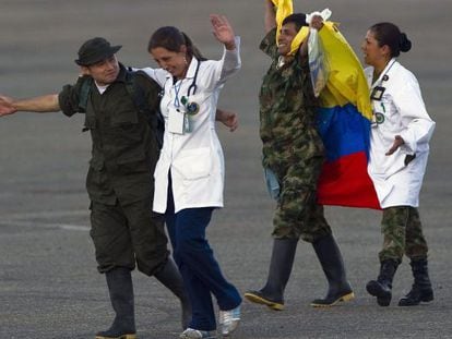 Medical personnel in Villavicencio, Colombia assist two former hostages released Monday.