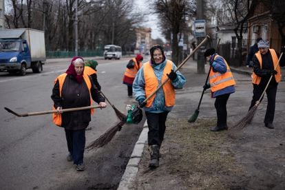 A cleaning crew working on the streets of Zhytomyr this week.