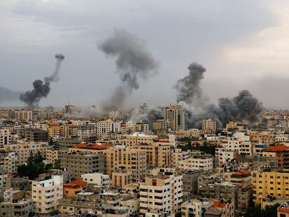 Smoke rises following Israeli strikes in Gaza, on Monday.