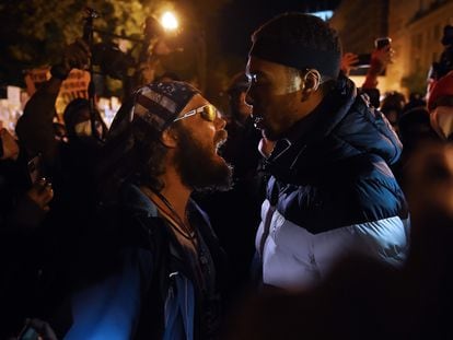 A Donald Trump supporter (l) clashes with a demonstrator at Black Lives Matter plaza across from the White House on election day in Washington, DC on November 3, 2020.