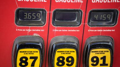 The prices of the various grades of gasoline available are displayed electronically on a pump at a filling station on Sept. 18, 2023, in Newcastle