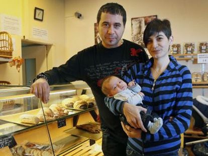 Jordi Cabau and Raquel Pérez with their son Asier, pictured in their fledgling bakery business.