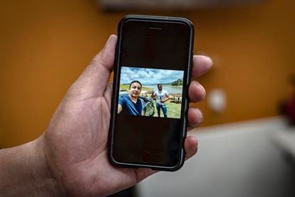 Nicandro Picazo holds up the last photo his son sent from Puebla with his friend Sebastián.
