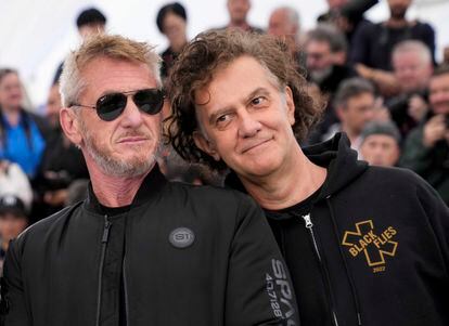 Sean Penn, left, and director Jean-Stephane Sauvaire pose for photographers at the photo call for the film 'Black Flies' at the 76th Cannes Film Festival.