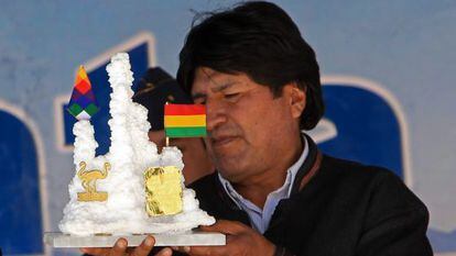 Evo Morales holds a present from a worker at a lithium plant.