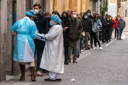 People line up for PCR tests in Madrid.