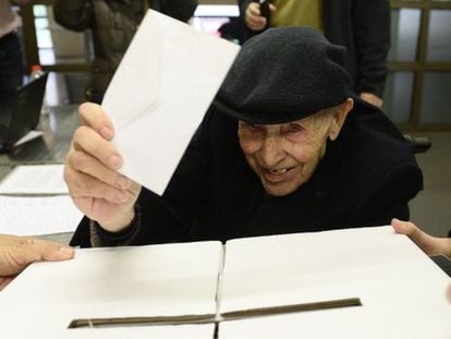 A 93-year-old voter casts his ballot in Barcelona on Sunday.