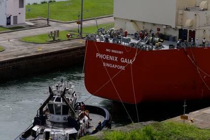 A cargo ship sails through the Panama Canal.
