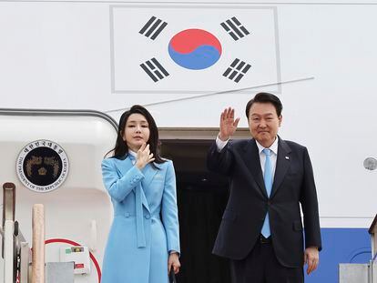 South Korean President Yoon Suk Yeol waves as him and his wife Kim Keon Hee stand before departing for the United States at the Seoul military airport in Seongnam, South Korea, on April 24, 2023.