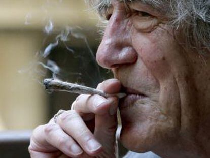 Howard Marks, known as Mr Nice, puffs on a joint.