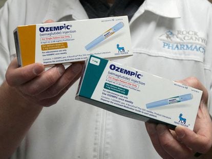 A pharmacist displays boxes of Ozempic, a semaglutide injection drug used for treating type 2 diabetes and obesity made by Novo Nordisk, March 29, 2023.