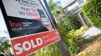 A real estate sign is posted outside of a recently sold home, on February 21, 2023, in Valrico, Florida.