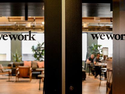 WeWork logos are seen at a WeWork office in San Francisco, California, on September 30, 2019.