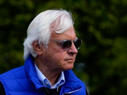 Bob Baffert walks near the stables ahead of the 148th running of the Preakness Stakes horse race at Pimlico Race Course, Friday, May 19, 2023, in Baltimore.