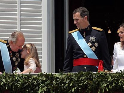 Juan Carlos embraces granddaughter Leonor on the day his son was crowned Felipe VI.