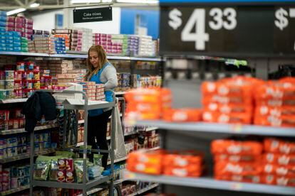 A worker organizes items at a Walmart Supercenter in North Bergen, N.J., on Thursday, Feb. 9, 2023.