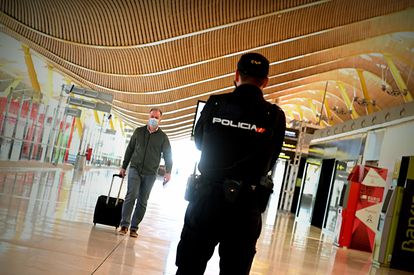 A police officer controls access to Terminal 4 at the Adolfo Suárez Madrid-Barajas airport after a state of alarm was declared in the region.