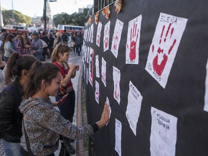 Women pay homage to the victims of male violence.