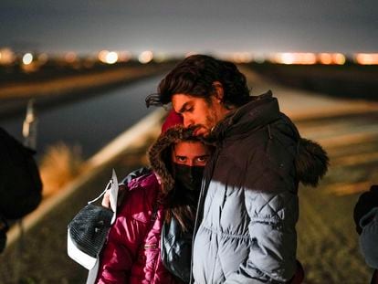 A Cuban couple waits to be processed at the U.S.-Mexico border, near Yuma, Arizona, in January 2023.
