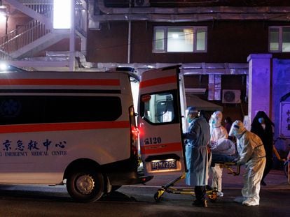 In Beijing, medical personnel put a patient inside an ambulance, on Friday, November 9, 2022.