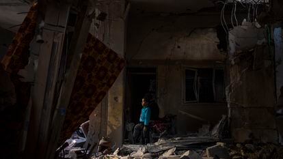 A boy looks at the damage to his family home following a bombing in Rafah, southern Gaza, on February 8.