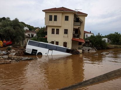 A bus submerged by floods in Patanias, Greece.