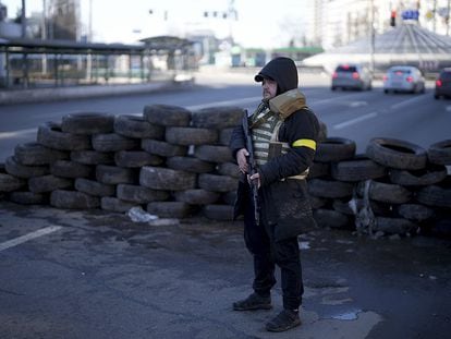 A member of a civil defense unit at a checkpoint in Kyiv, the capital of Ukraine.