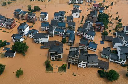 Houses surrounded by floodwaters in China’s Jiangxi province; June 21, 2022.