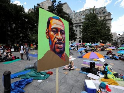 An image of George Floyd is seen at a protest to defund the police near City Hall, in New York City, New York, in June 2020.