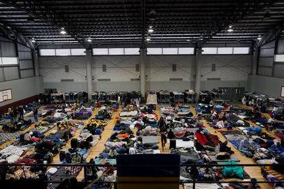 Ukrainian refugees wait in a gymnasium on April 5, 2022, in Tijuana, Mexico.