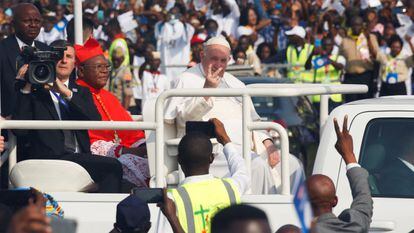 Pope Francis gestures next to Archbishop of Kinshasa Cardinal Fridolin Ambongo Besungu as they arrive for a Mass celebration, in Kinshasa, Democratic Republic of Congo, February 1, 2023.