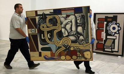 Workers ready the exhibition of Kunstmuseum works at the Reina Sofía.