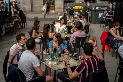 A sidewalk café in Santa Ana square in Madrid.