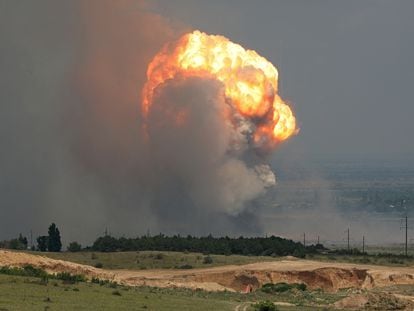 A column of smoke and fire from an explosion at a military training ground in the Kirovske district of Crimea on July 19.