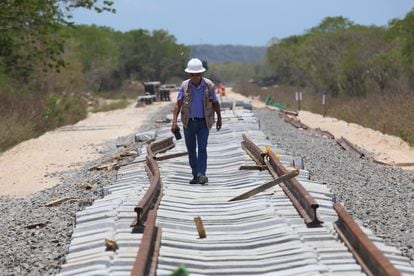 An engineer walks along the Tren Maya tracks in Yucatan.
