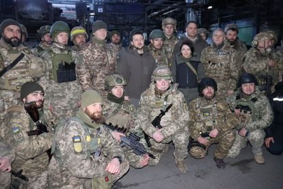 Gennadiy, bottom left, looking at the camera, during Volodymyr Zelenskiy's visit to Bakhmut on December 20.